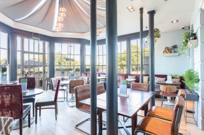 Photo Credit: Pitcher and Piano - leather style restaurant chairs in orangery